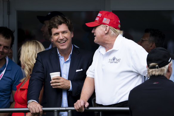 Fox News prime-time host Tucker Carlson with former president Donald Trump last year.