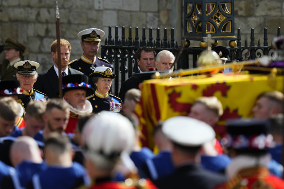 King Charles III, Princess Anne, Prince Andrew (centre right) and Prince Harry (rear left) follow the coffin of the Queen as it is carried out of Westminster Abbey.