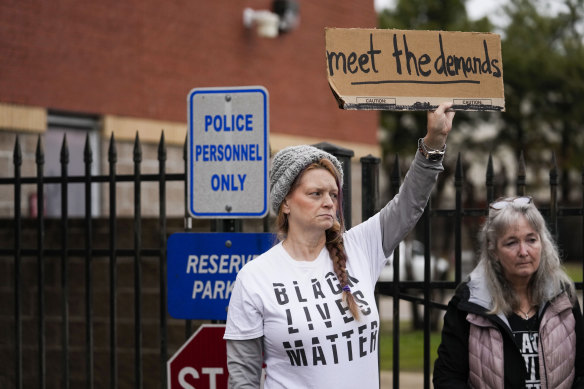 A group of protesters protest outside a Memphis police station in response to the death of Tire Nichols.
