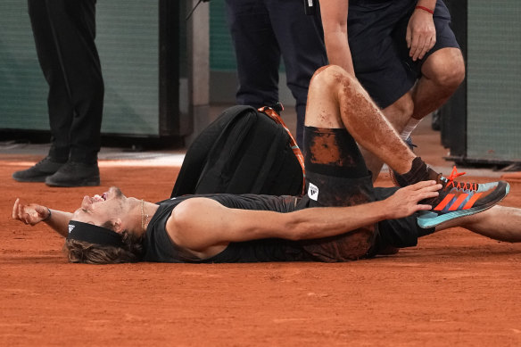 Germany’s Alexander Zverev grimaces in pain.