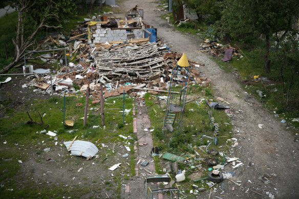 A damaged children’s climbing frame, in the shape of rocket, stands in the playground of a destroyed apartment block in Borodianka, Ukraine. 