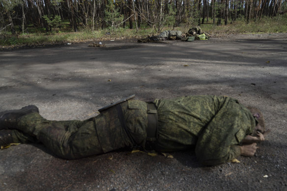 Dead bodies of Russian servicemen lie on the ground in the recently recaptured town of Lyman.