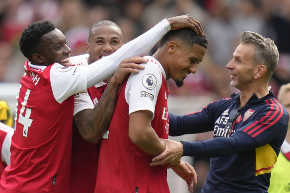 Arsenal’s Eddie Nketiah, left, Arsenal’s Gabriel, center, and Arsenal’s William Saliba celebrate after victory.