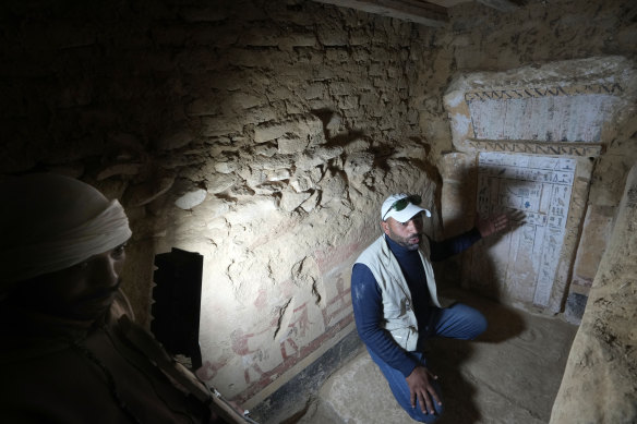 An Egyptian archeologist speaks at a recently discovered tomb dated to the Old Kingdom, 2700–2200 BC, at the site of the Step Pyramid.