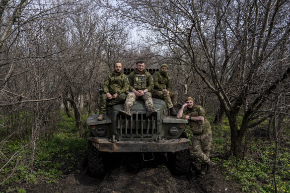 Ukrainian servicemen sit on their vehicle, on the frontline in Donetsk region on Saturday.