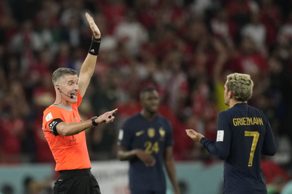 Antoine Griezmann remonstrates with referee Matthew Conger.