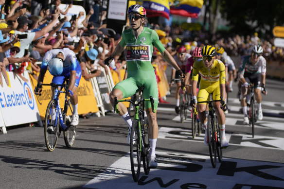 Michael Matthews, left, finishes second on stage eight to Wout van Aert, centre, and Tadej Pogacar. 