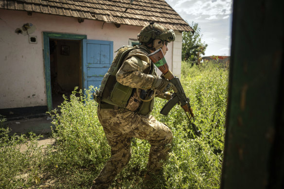 A Ukrainian serviceman of “Fireflies” reconnaissance team takes his position at the frontline in Mykolaiv region.