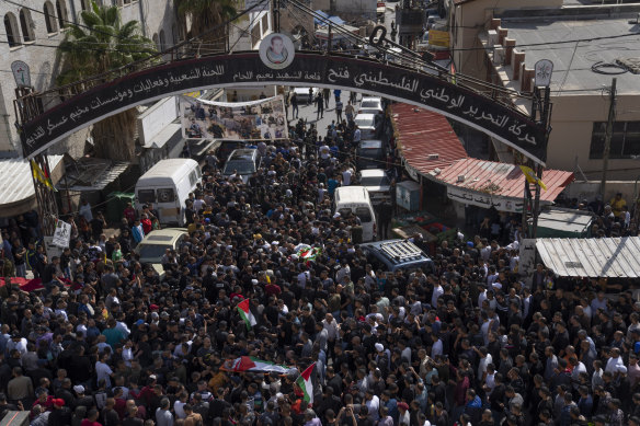 Mourners carry the bodies of Emad Abu Rasheed, 47, and Ramzi Zabarah, 35, in the refugee camp of Askar, near Nablus in the Israeli-occupied West Bank.
