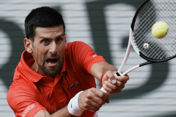 Serbia’s Novak Djokovic returns the ball to Slovenia’s Aljaz Bedene during their third round match of the French Open tennis tournament at the Roland Garros stadium Friday, May 27, 2022 in Paris.