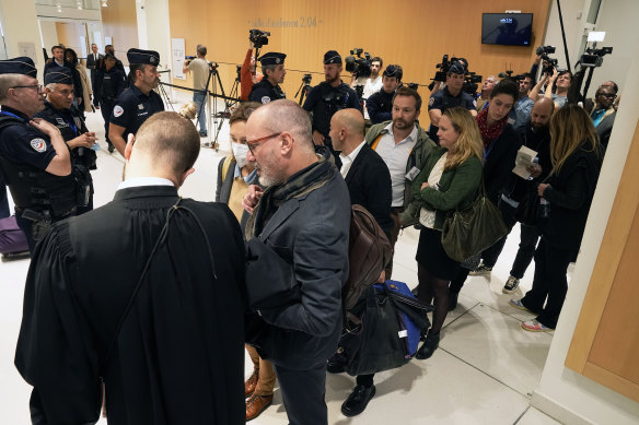 Civil parties arrive to attend the trial of Airbus and Air France companies in Paris.