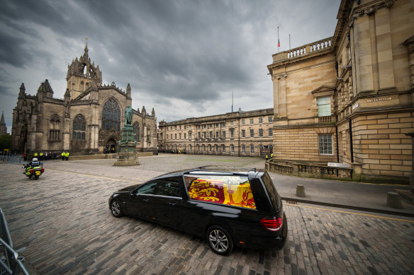 The cortege carrying the coffin of the late Queen Elizabeth II passes St Giles’ Cathedral on its way to Palace of Holyroodhouse in Edinburgh, United Kingdom.