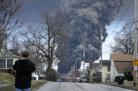 A black plume rises over East Palestine, Ohio, as a result of a controlled detonation of a portion of the derailed Norfolk Southern train on February 6.