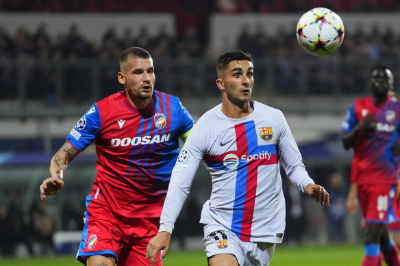 Ferran Torres, right, scored twice for Barcelona, who will miss the knockout stages for a second straight year.