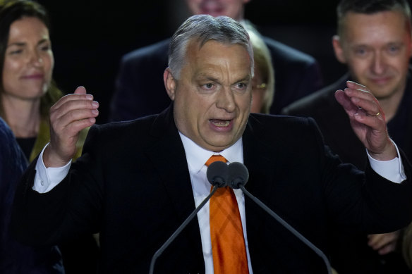 Hungary’s Prime Minister addresses cheering supporters during an election night rally in Budapest.