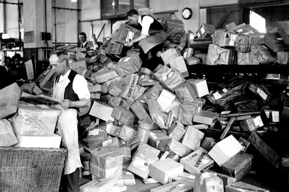 General Post Office employees preparing to sort Christmas parcels, 1929.