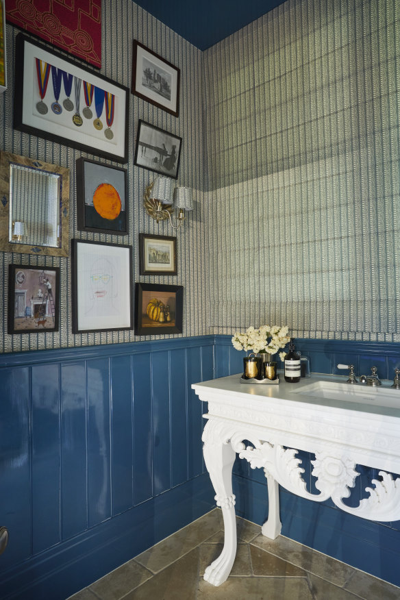 The powder room features an art wall, “some of it is important, some just eye-candy”, says Charlotte.  “The famous decorator Robert Kime once said to ‘Put something modest next to something quite grand - they will help each other to be more interesting’. I like this idea,” says Charlotte.