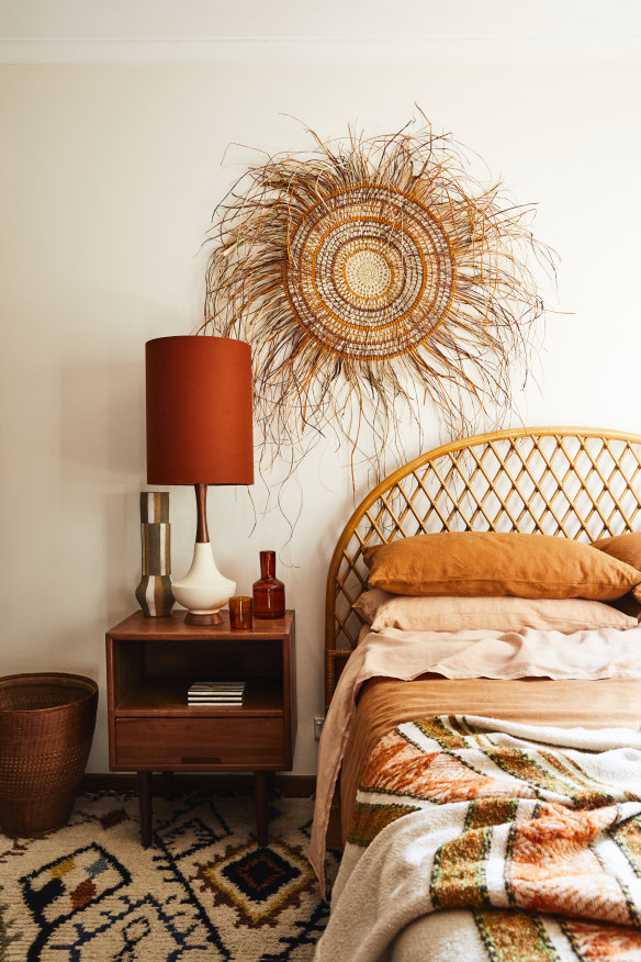 A serene  woven artwork by Melbourne artist Anna Fiedler hangs in the guest bedroom.  The bedlinen is from Bed Threads.