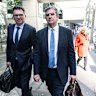 ICAC witness Martin Berry (right) leaves the commission on Tuesday.