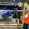 Police said they found the plastic-wrapped drug bricks inside boat engines being delivered from California.