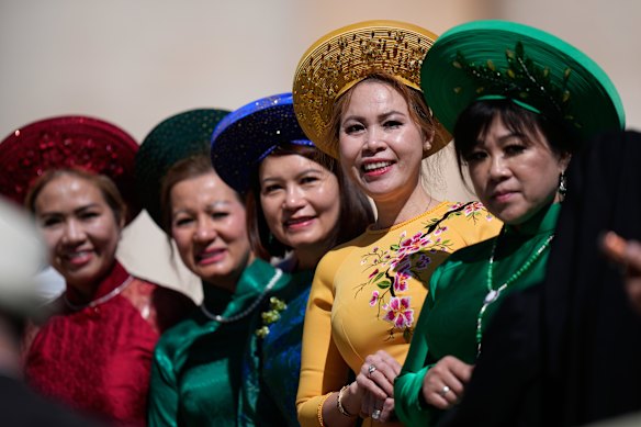 Vietnamese women wait for the weekly audience with Pope Leo XIV in St Peter's Square at the Vatican.