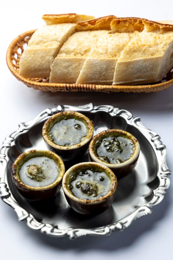 Gigi's escargot with garlic and parsley butter ($12), and baguette ($6 extra).