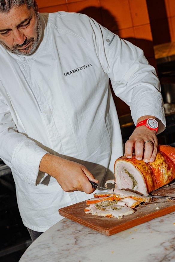 Orazio D'Elia preparing the pork. 
