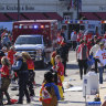 Police clear the area following a shooting at the Kansas City Chiefs NFL football Super Bowl celebration.