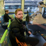 Rick Gned on the train during his long commute to work in Melbourne’s inner east.