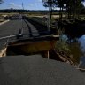 Destroyed bridge splits community already suffering amid flood recovery