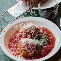 A dollop of basil pesto adds piquancy to this classic meatball dish.