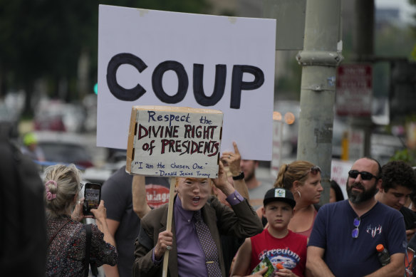 Protesters gather outside the courthouse in Washington on Friday.