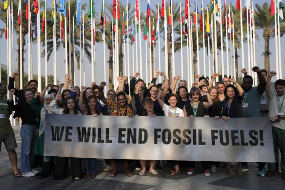 The COP28 final agreement did not achieve “the end of fossil fuels” as Greenpeace protesters, seen here, and others wanted.