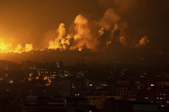 Fire and smoke rise following an Israeli airstrike on Gaza City on Sunday. There are sprawling questions about the geopolitical consequences of the Israel-Hamas war.