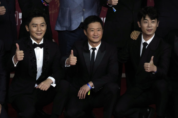 Actors from the movie “The Battle at Lake Changjin” from left, Li Chen, Wu Jing and Zhu Yawen.