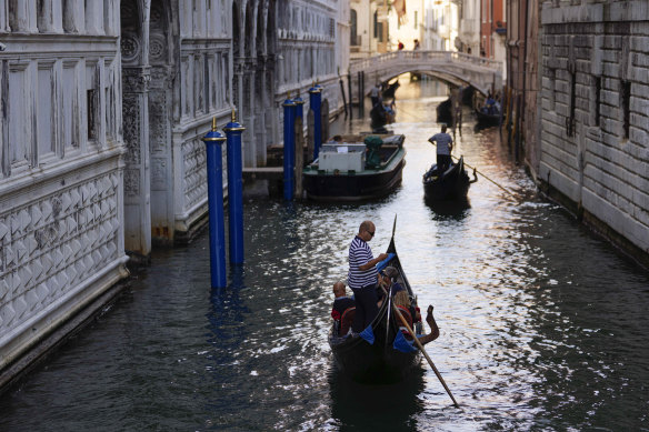 Tourists have returned to Venice after pandemic shutdowns but now face higher taxes.