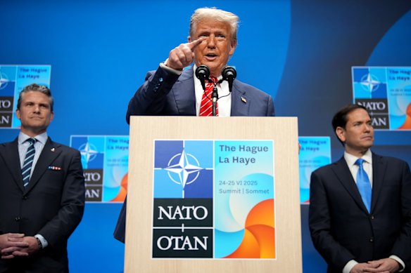 US President Donald Trump is flanked by Defence Secretary Pete Hegseth and Secretary of State Marco Rubio as speaks to the press following the NATO summit.