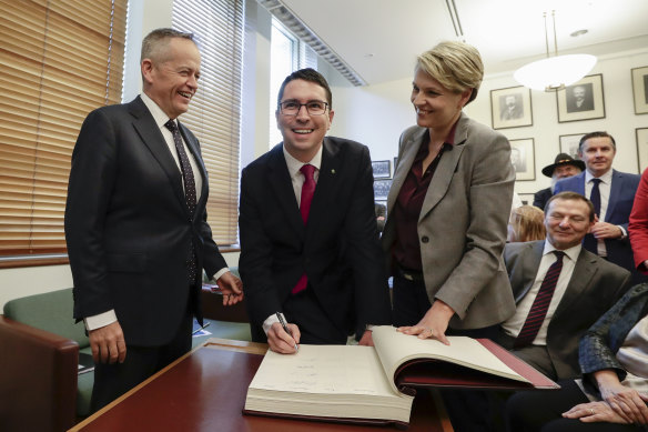 Mr Gorman, flanked by Opposition Leader Bill Shorten and Deputy Opposition Leader Tanya Plibersek, signs the Labor caucus book ahead of his first caucus meeting in Canberra.