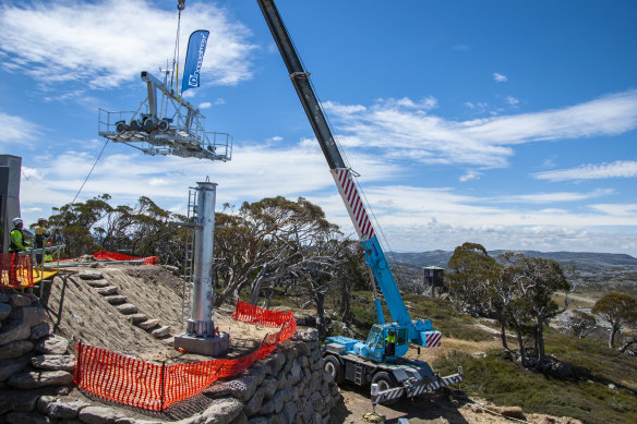 One of the new ski lift towers at Perisher being installed by crane.