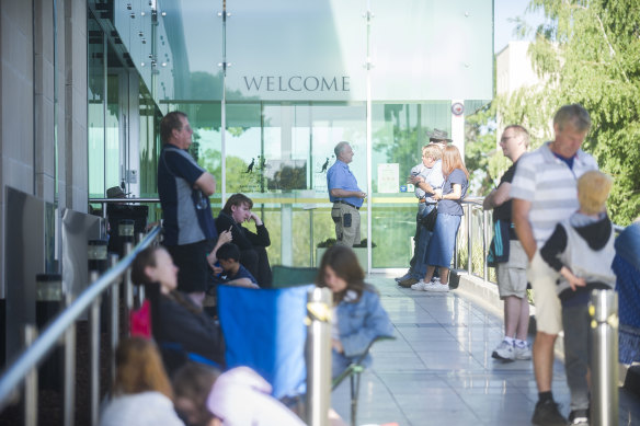 People wait outside the Royal Australian Mint for the first ticket to be pulled for the first coin strike of 2019.