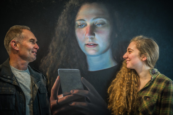 Ross Townsend with his daughter Hannah and his portrait of her which was a finalist in the Douglas Moran National portrait prize in 2017.