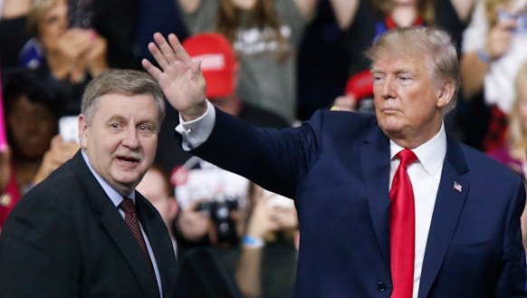 President Donald Trump, acknowledges the crowd during a campaign rally with Republican Rick Saccone on  Saturday.