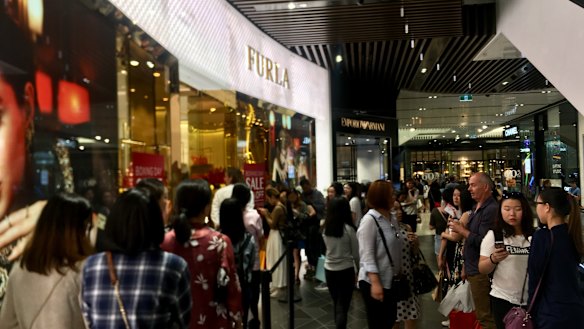 In Emporium, security guards were keeping the crowds in order.