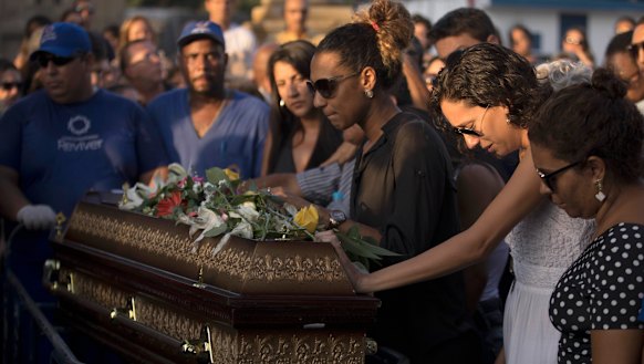 Marielle Franco's relatives grieve during her burial in Rio de Janeiro, Brazil, 