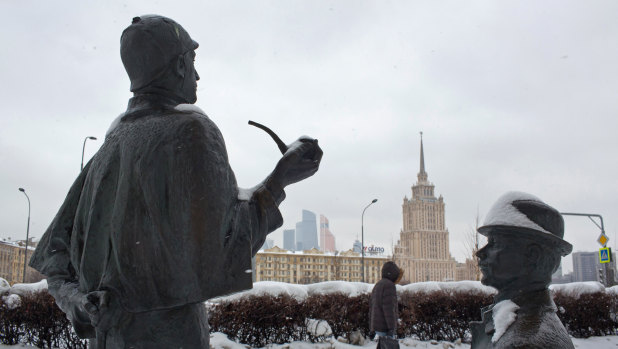 A monument to Sherlock Holmes, left, and Dr Watson, the fictional private detectives, sits near the Radisson Royal Ukraine Hotel and the British embassy in Moscow, Russia.