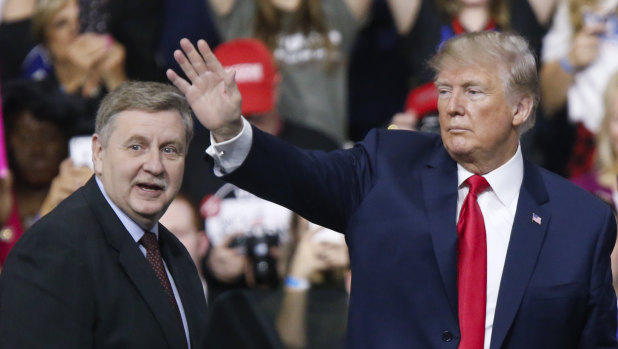 President Donald Trump, acknowledges the crowd during a campaign rally with Republican Rick Saccone on  Saturday.