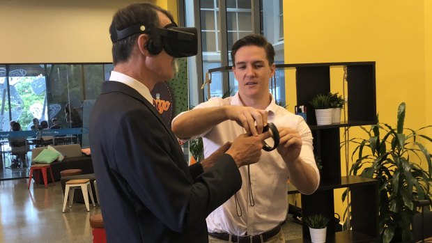 Brisbane's Lord Mayor Graham Quirk and Equal Reality co-founder Rick Martin using virtual reality.