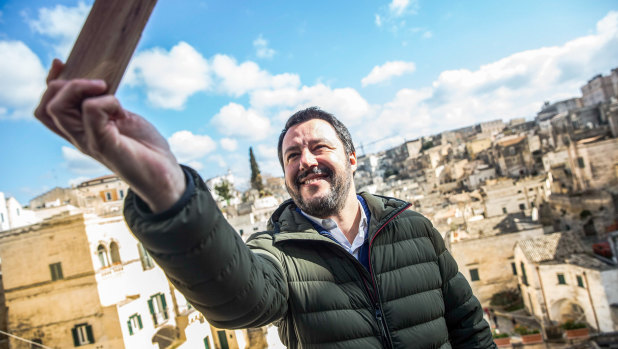 Matteo Salvini, leader of the anti-migrant and eurosceptic party, The League, takes a selfie on the campaign trail.