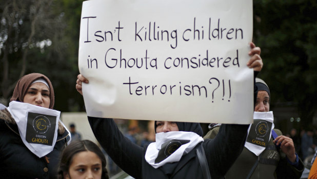 A Lebanese woman protests the assault on Ghouta.