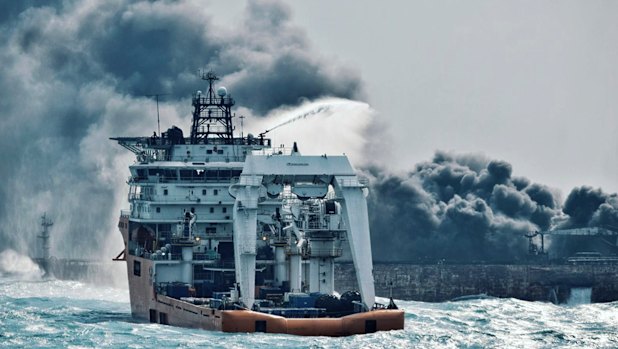 In a photo dated 10 January 2018, China's Ministry of Transport, a firefighting boat works to put on a blaze on the oil tanker Sanchi in the East China Sea off the eastern coast of China. 